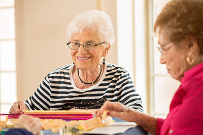 Women playing Scrabble