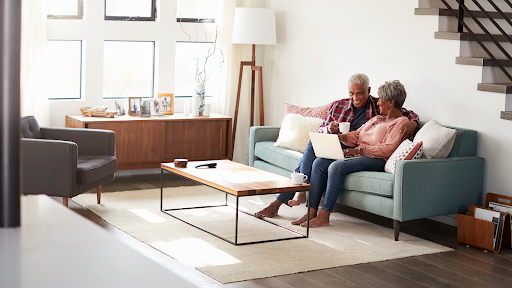 senior couple having coffee in their apartment